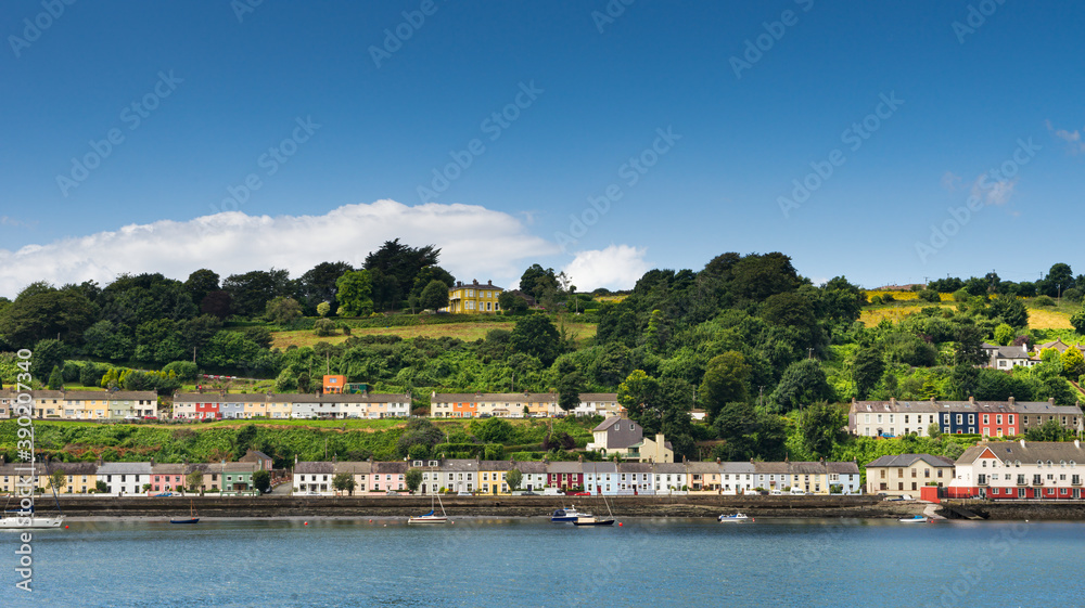 Panoramic view of colorful houses in Monkstown on the banks of the River Lee and near Cork City in Ireland.