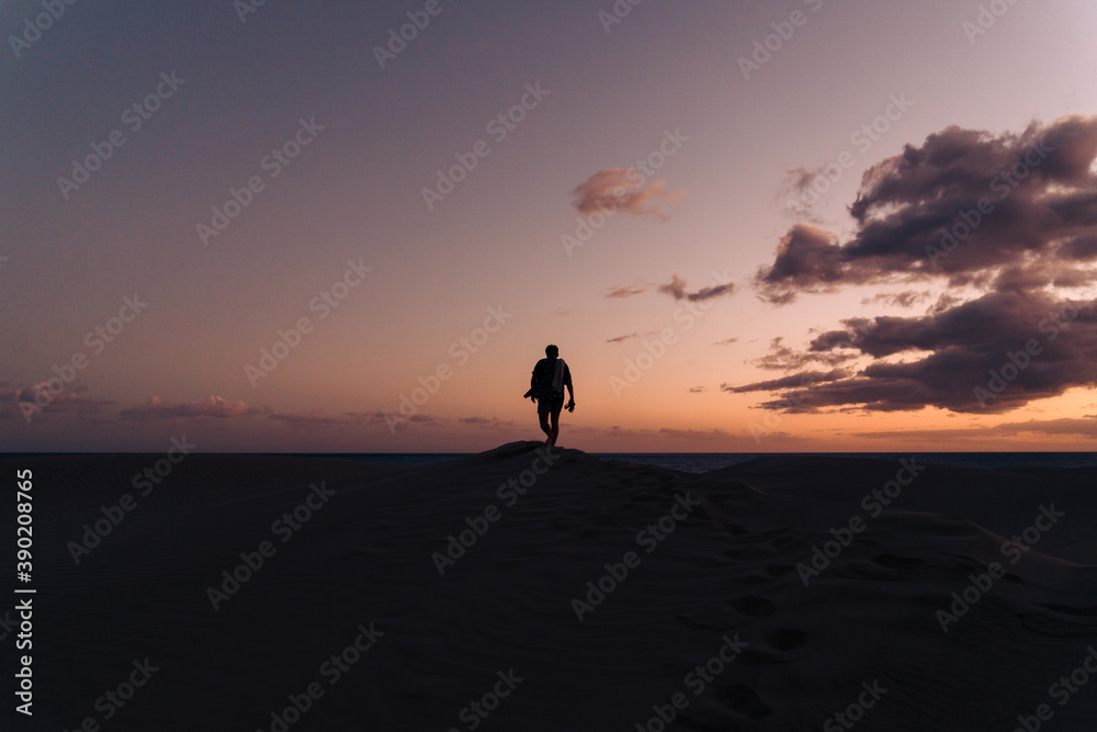 Silhouette of a man hiking Silhouette of a man hiking