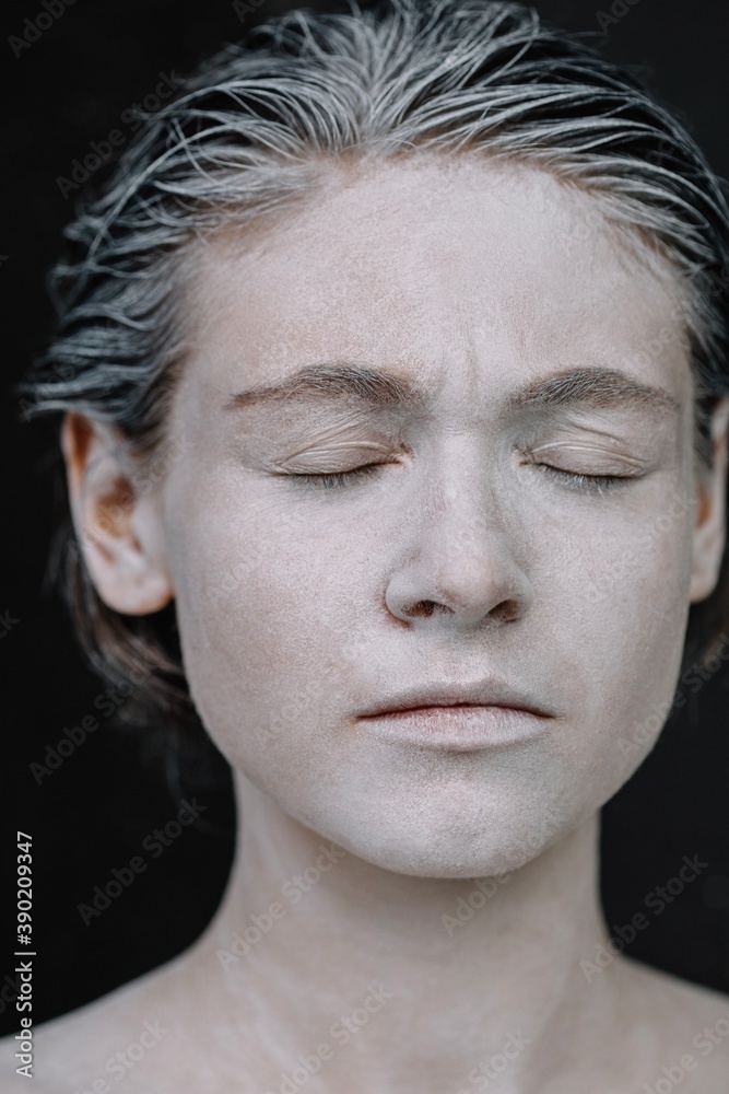 Woman with painted face and closed eyes Woman with painted face and closed eyes
