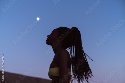 African woman and the moon photo