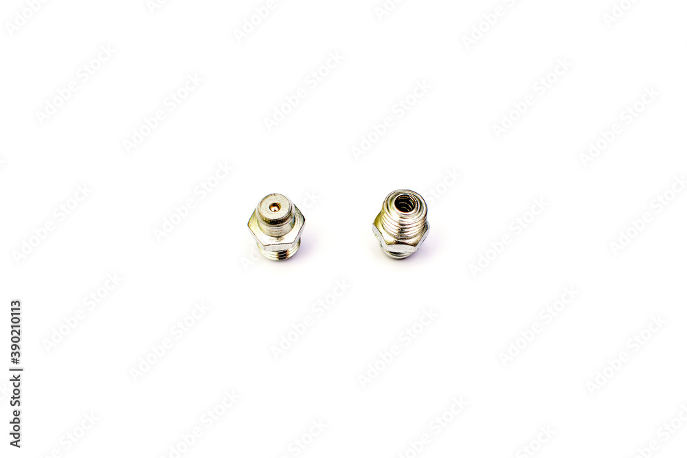 Grease nipple fittings for machine spare parts isolated on the white background. New spare parts. Grease nipple fittings for machine spare parts isolated on the white background. New spare parts.