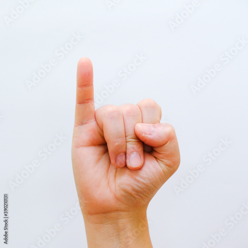 Closeup little finger isolated on white background. sign of promise concept. hand showing little finger Give undertaking one word.