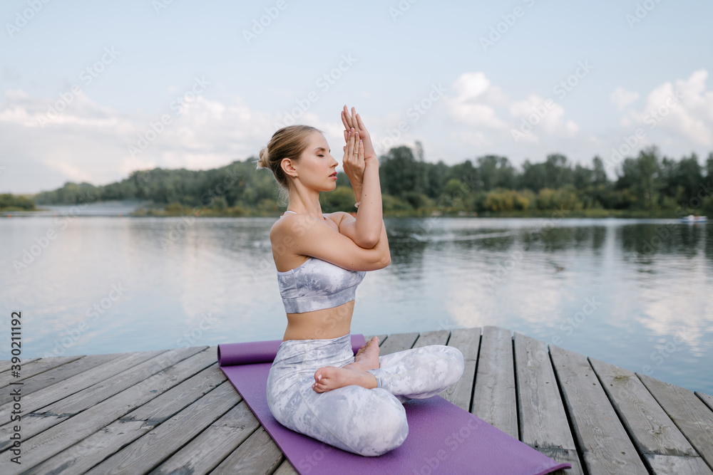 Woman practicing yoga in nature Woman practicing yoga in nature