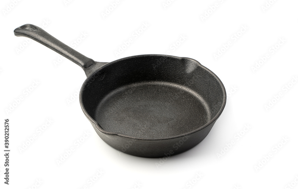 Cast iron frying pan isolated on a white background. Concept of kitchen utensils. Cast iron frying pan isolated on a white background. Concept of kitchen utensils.