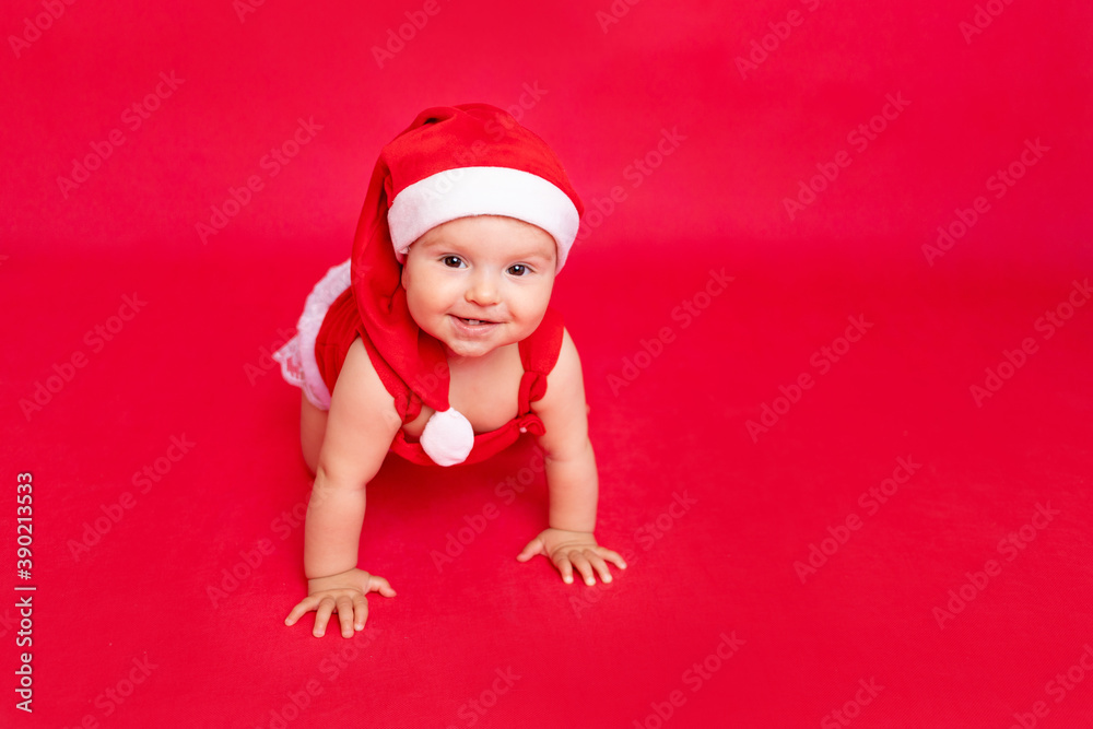 child on a red background in a Santa suit, the concept of new year and Christmas, place for text child on a red background in a Santa suit, the concept of new year and Christmas, place for text