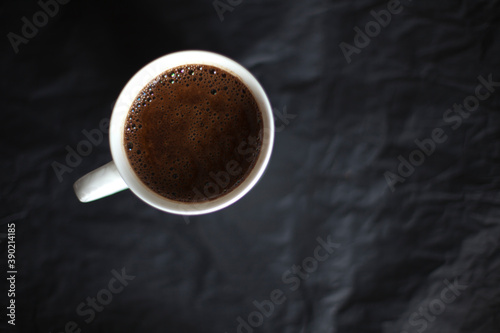 Fototapeta Naklejka Na Ścianę i Meble -  Cup of coffie on a black background