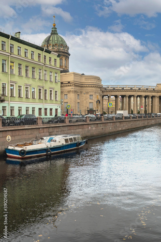 tourist pleasure ship parked on the Griboyedov Canal in the historic center of St. Petersburg