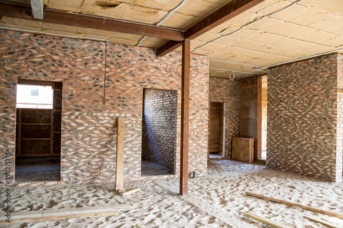 Construction of houses. Walls  brick internal partitions  ceiling made of blocks covered with clay  metal supports.