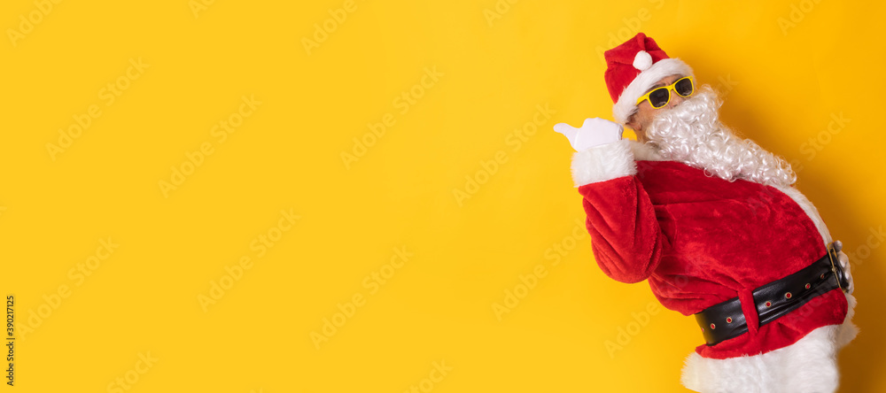 santa claus isolated on background pointing for ad or text