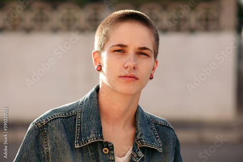 Androgyne woman with shaved hair