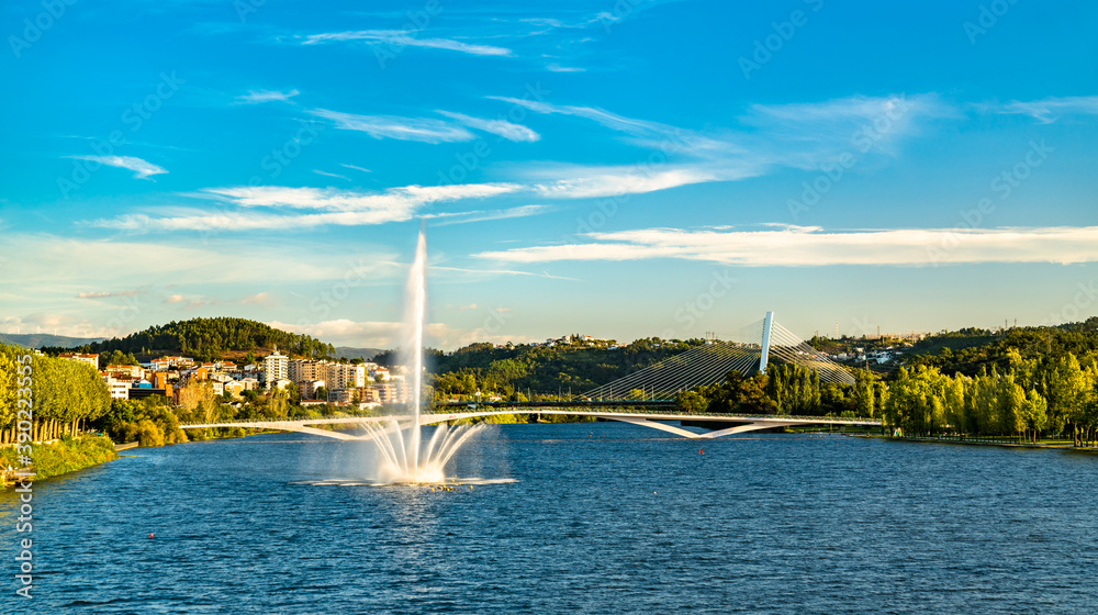 View of a fountain on the Mondego river in Coimbra, Portugal