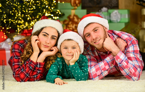 Idyllic moment. Family values. Spend time with family. Parents child waiting for Santa. Winter holidays. Parenthood happiness. Christmas tradition. Father mother little son christmas tree background