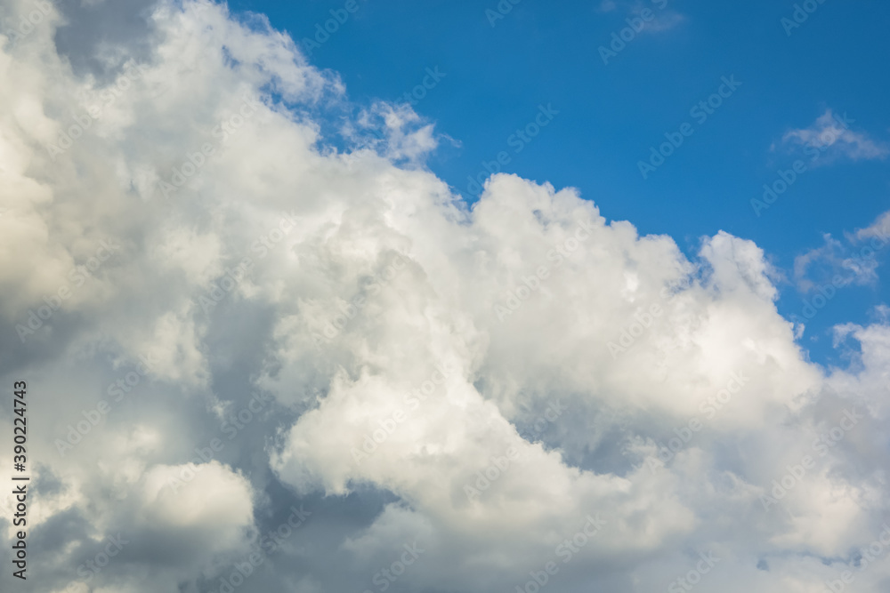 Background of white Cumulus clouds in a blue sky. The concept of weather and rain. Pre-storm state of nature. The natural background. Full frame with copy space Background of white Cumulus clouds in a blue sky. The concept of weather and rain. Pre-storm state of nature. The natural background. Full frame with copy space