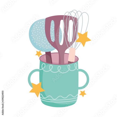cooking, skimmer spatula and manual mixer in cup