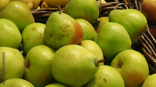 fruits and dried fruits in the store, in packaging, a woman chooses Supermarket , fruit and vegetable zone. photo