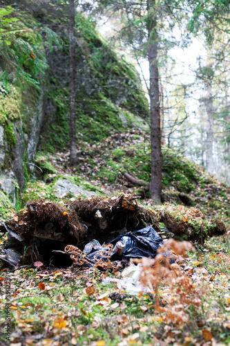 big amount of trash in forest, global environment issues