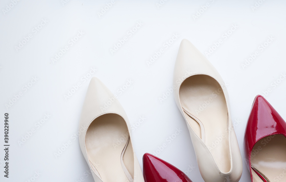 a pair of shoes, beige and red patent leather pumps with heels, on a light background. Fashionable, stylish, women's shoes. Nice shoes, preparation for the holiday, sale, expensive gifts. Diseases of a pair of shoes, beige and red patent leather pumps with heels, on a light background. Fashionable, stylish, women's shoes. Nice shoes, preparation for the holiday, sale, expensive gifts. Diseases of