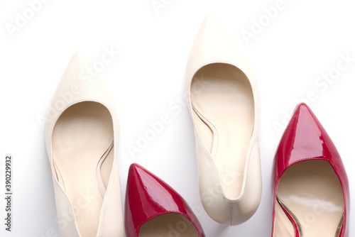 a pair of shoes, beige and red patent leather pumps with heels, on a light background. Fashionable, stylish, women's shoes. Nice shoes, preparation for the holiday, sale, expensive gifts. Diseases of 