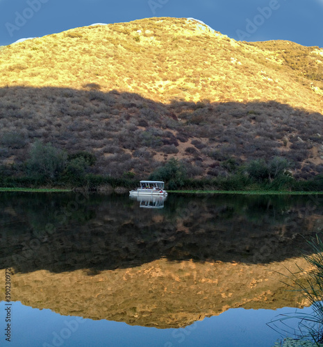 Very nice reflection on the lake san marcos, San Diego, California. The sky and highland is reflected in the water of Lake San Marcos. Reflection on lake and water.