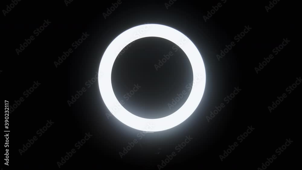 Male hand make gestures through the circle of light on black background, close-up isolated. Okay, peace, thumb up Male hand make gestures through the circle of light on black background, close-up isolated. Okay, peace, thumb up