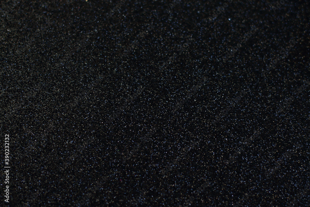 Obraz premium Black glitter texture Christmas abstract background, shiny vintage lights background. light silver and black, defocused. 