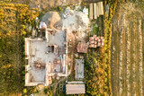 Top down aerial view of a house under construction with concrete foundament and brick walls.