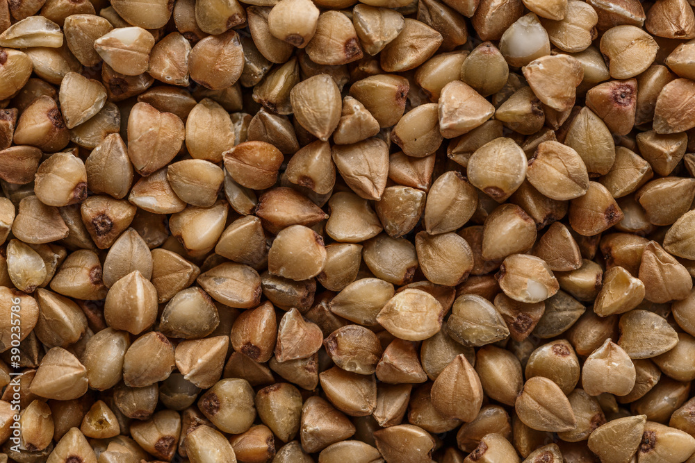 Buckwheat. The concept of diet and healthy eating, the background texture of the buckwheat. Macro photography of buckwheat texture.gluten free ancient grain for healthy diet,top view. Buckwheat. The concept of diet and healthy eating, the background texture of the buckwheat. Macro photography of buckwheat texture.gluten free ancient grain for healthy diet,top view.