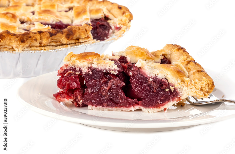 A Slice of Cooked Cherry Pie on a White Porcelain Plate with a Fork Isolated on White Background A Slice of Cooked Cherry Pie on a White Porcelain Plate with a Fork Isolated on White Background