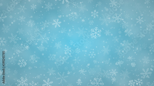 Christmas background of snowflakes of different shapes, sizes and transparency in light blue colors