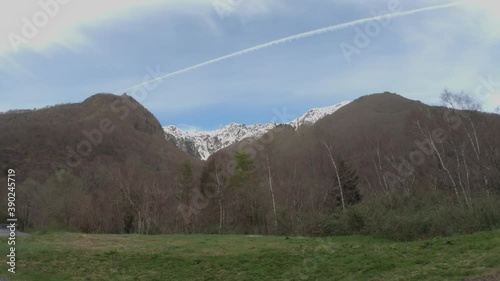 SLOW MOTION SHOT - Car driving on the winding road to Bridge of Spain (Route du Pont d'Espagne), Cauterets in the Haute-Pyrénées department, France. photo