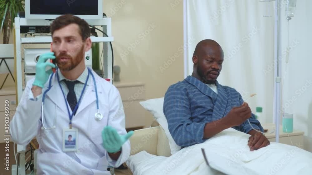 Caucasian busy doctor ignoring his patient talking on mobile phone arguing neglecting his duties. Incompetent medical worker. Bad healthcare, indifference. Hospitals. Caucasian busy doctor ignoring his patient talking on mobile phone arguing neglecting his duties. Incompetent medical worker. Bad healthcare, indifference. Hospitals.