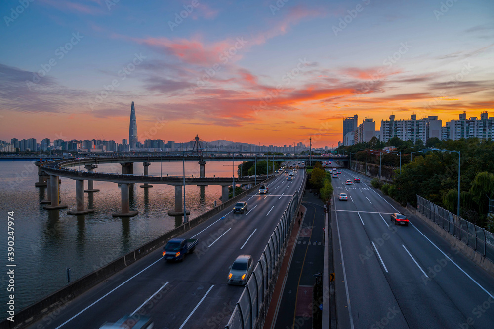  traffic at gwangnaru bridge   river bank during sunset  in seoul city south korea