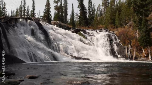 Beautiful Lewis Falls in Yellowstone. Named for explorer Merriweather Lewis of the Lewis and Clark expedition it drops 30 on the Lewis River. photo