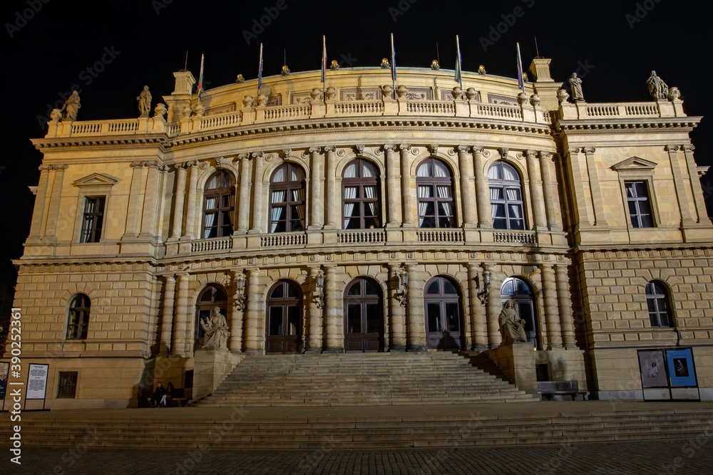 
illuminated neo-renaissance building Rudolfinum on the square in Prague exposed in 1885 and lights from street lighting at night in the Czech Republi