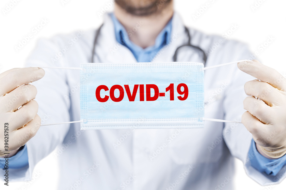 Hands in medical gloves hold medical protective mask. Hands in medical gloves hold medical protective mask.