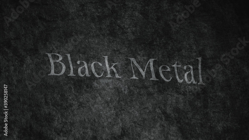 Black Metal text on the wall. Close-up. Black wall texture