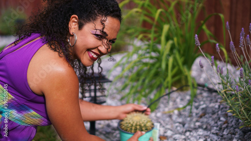 Beautiful biracial woman in garden in backyard