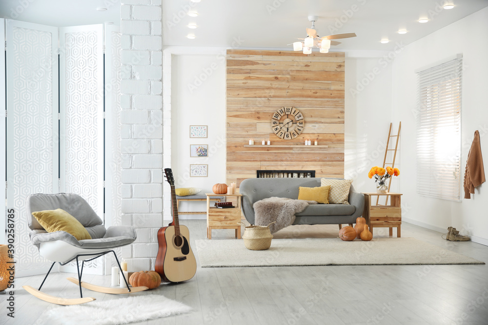 Cozy living room interior with comfortable furniture, guitar and autumn decor - obrazy, fototapety, plakaty 