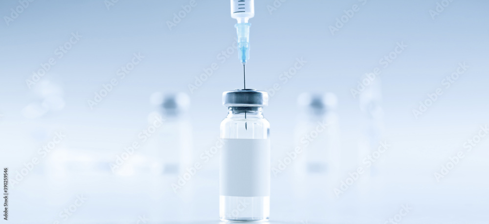 Medical syringe with a needle and a bollte with vaccine. Medical syringe with a needle and a bollte with vaccine.