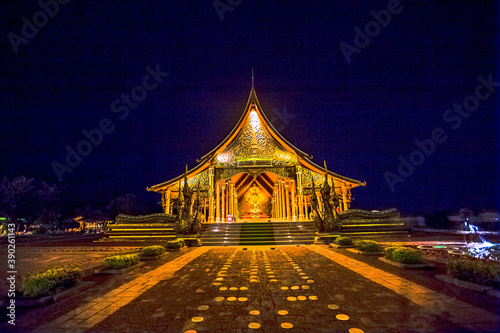 blurred abstract background of the twilight sky in the evening at one of the beautiful tourist spots in Ubon Ratchathani(Wat Sirindhorn Wararam)WatPhuPhrao,tourists always come see the glowing church.