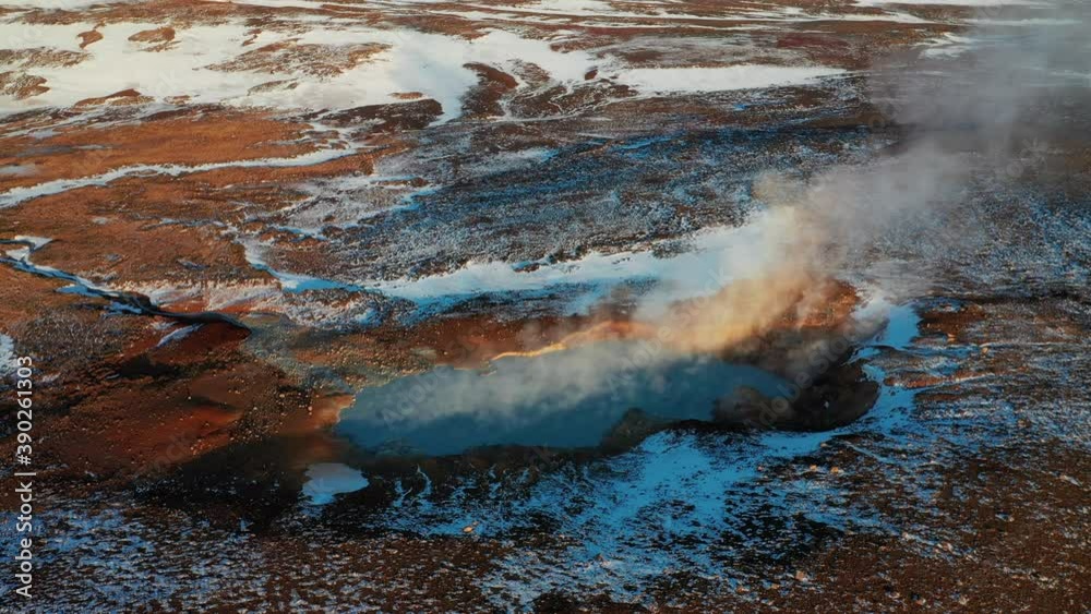 Geothermal Steam Rising Above The Blue Lake In Volcanic Lava Field - South Iceland - Aerial Drone Shot Geothermal Steam Rising Above The Blue Lake In Volcanic Lava Field - South Iceland - Aerial Drone Shot