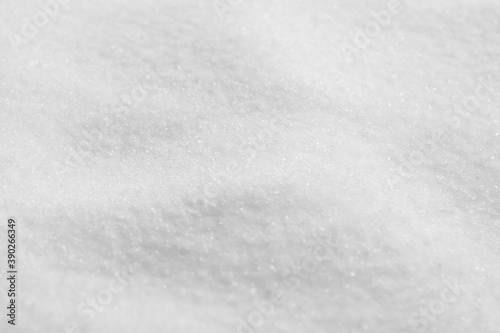 Natural white salt as background, closeup view