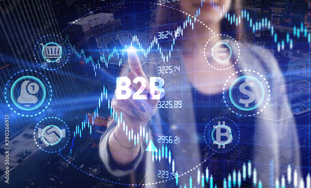 Business, Technology, Internet and network concept. Young businessman working on a virtual screen of the future and sees the inscription: B2B Business, Technology, Internet and network concept. Young businessman working on a virtual screen of the future and sees the inscription: B2B