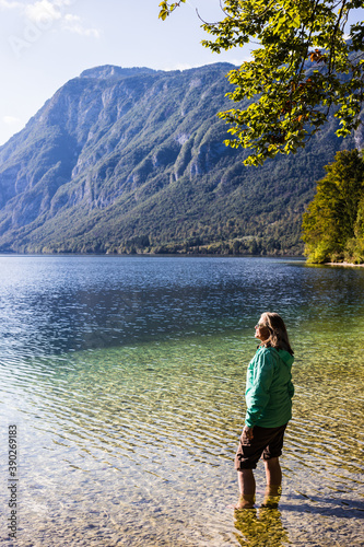 A young woman relaxing in a beautiful mountain lake in Slovenia, Europe. © Jonas Tufvesson