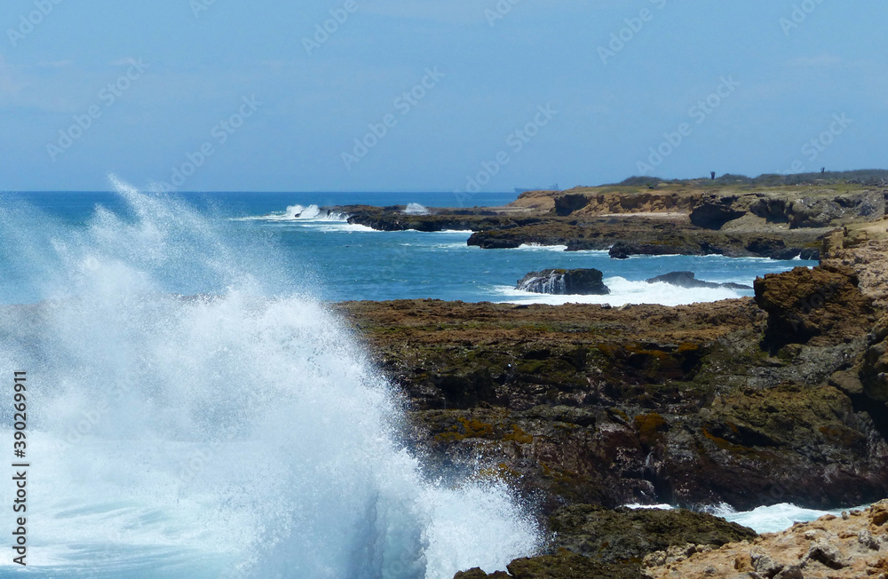 Waves of the Pacific Ocean crashing against the rock at La Chocolatera. Santa Elena province, Salinas, Ecuador
