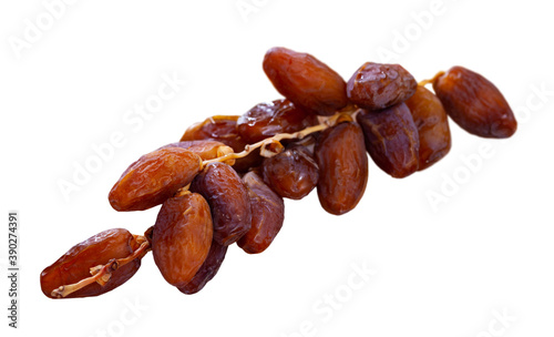 Tasty dried date close up, traditional mediterranean fruit. Isolated over white background
