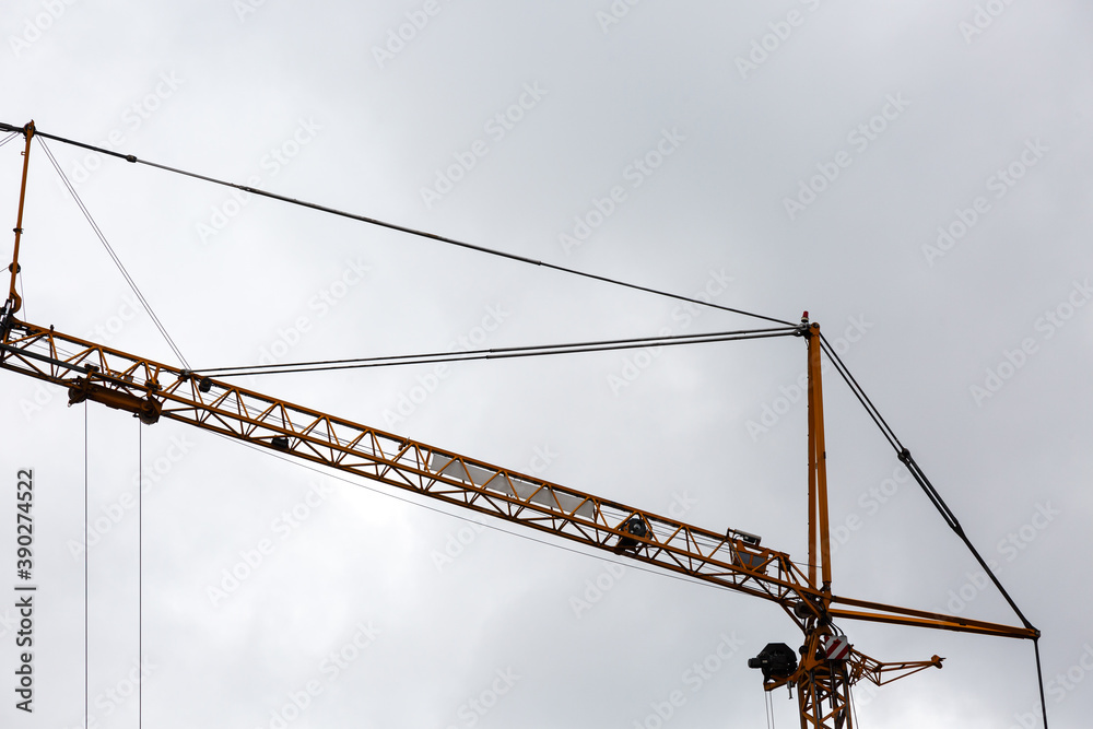 Crane at work and cloudy sky