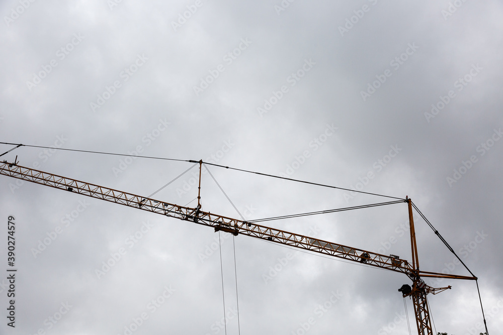Crane at work and cloudy sky