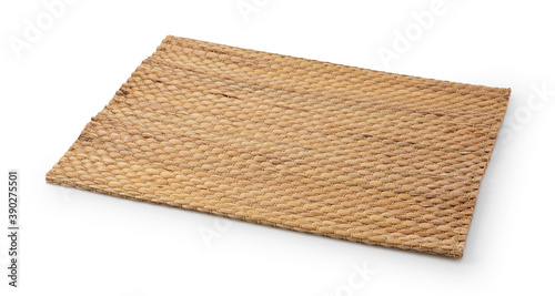 A woven luncheon mat on a white background