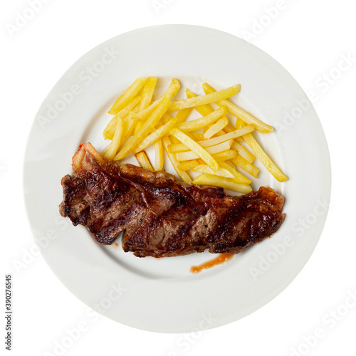 Tasty grilled beef tenderloin with french fries served at plate. Isolated over white background